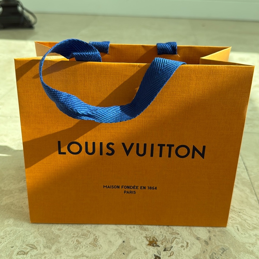 Louis Vuitton shopping bag. 8.75” x 7” x 4.5”